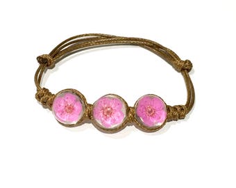 Bracelet, glass beads with dried flowers and Brown, adjustable leather cord.