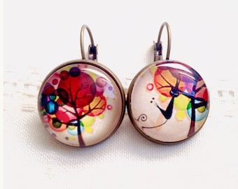Earrings , asymmetric, cabochon, tree of life in the colored circles and the black cat.