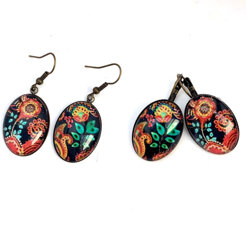 Oval cabochon earrings, stylized flowers on a dark background, mid-length. image 1