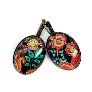 Oval cabochon earrings, stylized flowers on a dark background, mid-length. Dormeuses