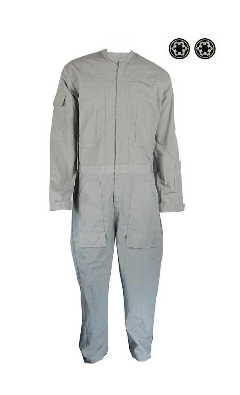 May include: A gray jumpsuit with a zipper closure and two pockets on the front. The jumpsuit has a mandarin collar and long sleeves. Two black and silver circular patches are included.