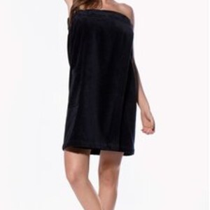 May include: Black wrap-around towel with a soft, plush texture. The towel is designed to be worn like a robe and has a simple, elegant style.