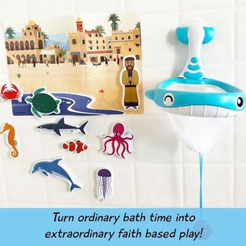 May include: A blue bath toy with a net and a suction cup. The toy is shaped like a fish and has a smiling face. The toy is hanging from a white tiled wall. There are also several colorful bath toys on the floor, including a seahorse, a shark, an octopus, a jellyfish, and a fish. The image also includes a picture of a man in a robe standing in front of a building. The text on the image says "Turn ordinary bath time into extraordinary faith based play!"