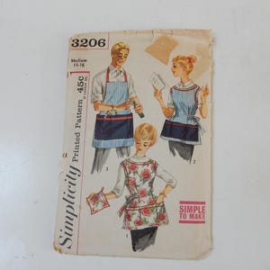 May include: Vintage Simplicity sewing pattern 3206, featuring illustrations of aprons. The pattern includes a medium size range of 14-16. The cover has the text "Simple to Make" and the price of 45c.
