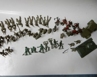 May include: A collection of green and red plastic toy soldiers, including a tank, a jeep, and various infantry figures.