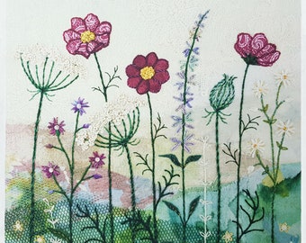 May include: Embroidered artwork featuring a variety of pink, purple, and white flowers with green stems and leaves. The flowers are arranged in a vertical line, with the tallest flower at the top and the shortest flower at the bottom. The background is a light beige color.