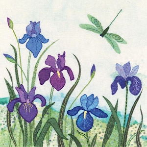 May include: An embroidered artwork featuring a dragonfly and five iris flowers in shades of blue, purple, and green. The flowers are depicted with intricate details and are arranged in a natural, flowing pattern.