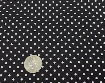 May include: Black fabric with a white polka dot pattern. A US quarter is included for scale.