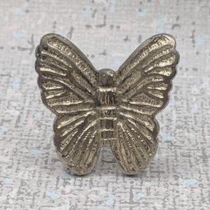 May include: A distressed wooden sign, inscribed with "Welcome to our home" in a handwritten font. The sign has a rustic finish, ideal for a porch or hallway, creating a welcoming atmosphere.