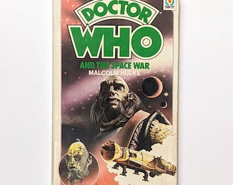 May include: A vintage paperback book cover for "Doctor Who and the Space War" by Malcolm Hulke. The cover features a green and white title, a dark-skinned alien with a long beard, and a spaceship in the background.