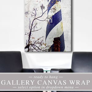May include: Canvas print of a lighthouse with blue and white stripes, a red top, and a brick chimney. The image has a vintage, textured effect. The words "ready to hang" and "Gallery Canvas Wrap" are displayed.