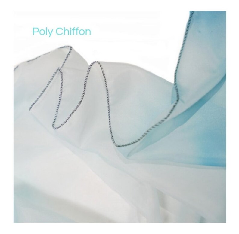 May include: Close-up of a light blue and white ombre poly chiffon fabric with a black and white stitched edge. The fabric is soft and sheer, and the ombre effect is subtle.