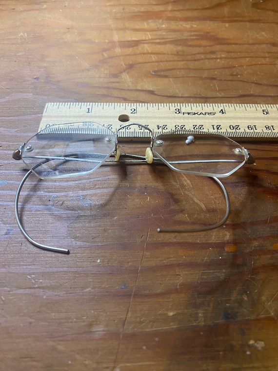 Pair of vintage eyeglasses with wire side earpieces i… Gem