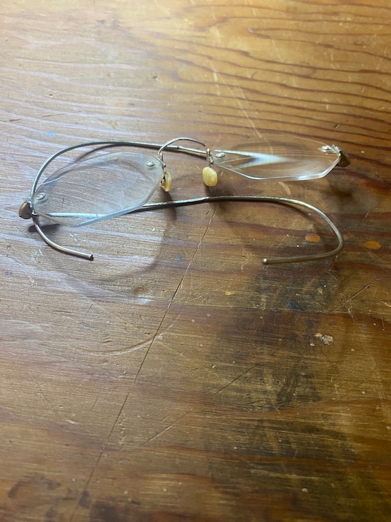 Pair of vintage eyeglasses with wire side earpieces i… Gem