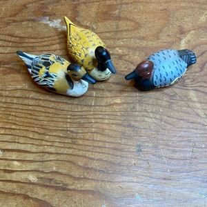 3 small duck figurines