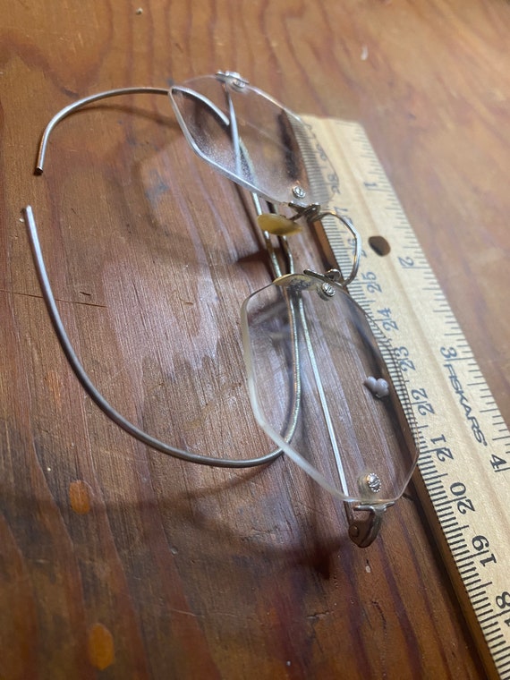 Pair of vintage eyeglasses with wire side earpieces i… Gem