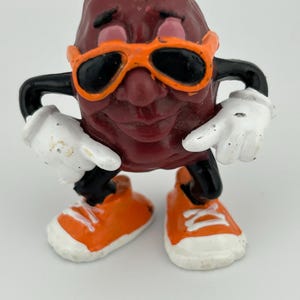 California Raisin (orange glasses & sneakers)