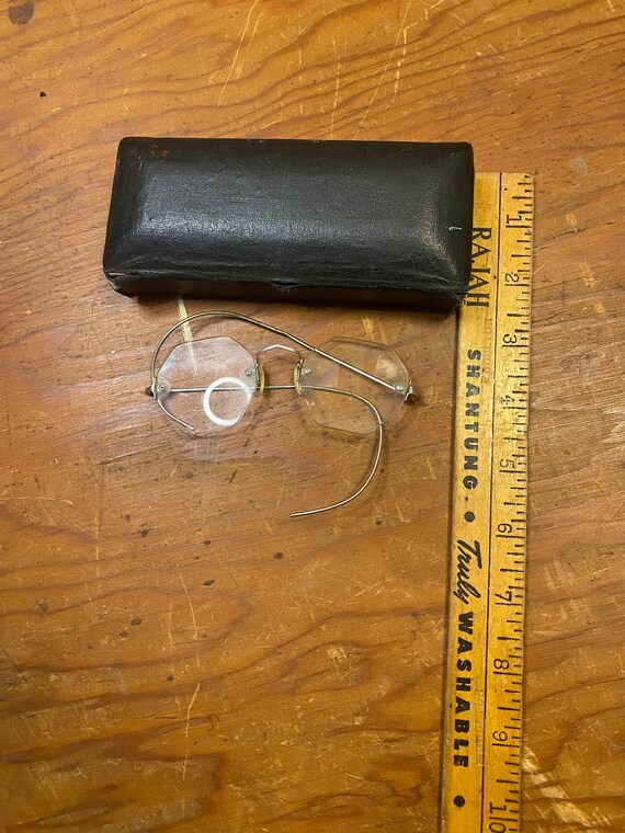Pair of vintage eyeglasses with wire side earpieces i… Gem