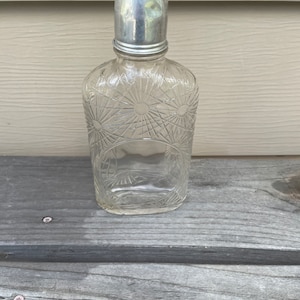 The American Medicinal Spirits company Cut Glass Bottle with Green top and metal shot glass