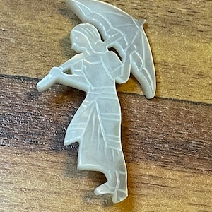 Vintage woman with umbrella brooch