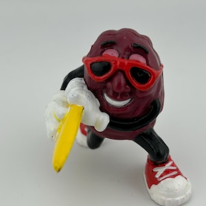 Surfer California Raisin with yellow surfboard