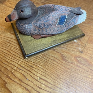Wooden Duck Carving on display board