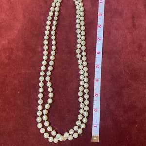 String necklace of faux pearls