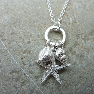 Cowrie, starfish & dogwhelk necklace in sterling silver...