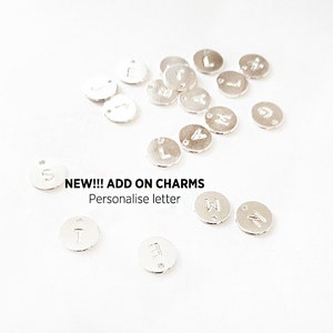 May include: Silver letter charms for jewelry making.  NEW!!! ADD ON CHARMS Personalise letter