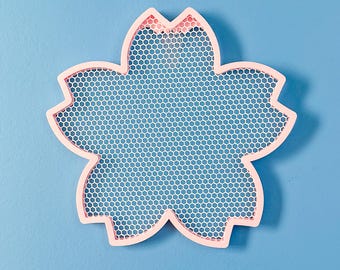 Exhibición de aros con alfileres de flor de cerezo Sakura