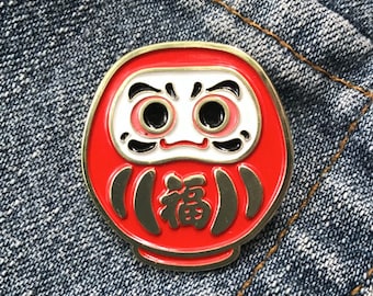 Pin de solapa esmaltado Daruma