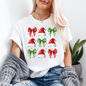 Christmas Santa Hat Coquette Bow Shirt, Cute Christmas T-Shirt, Christmas Shirts, Winter Season Shirt, Retro Christmas Shirt
