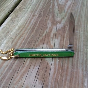 1970s United Nations pocket knife key chain. image 3