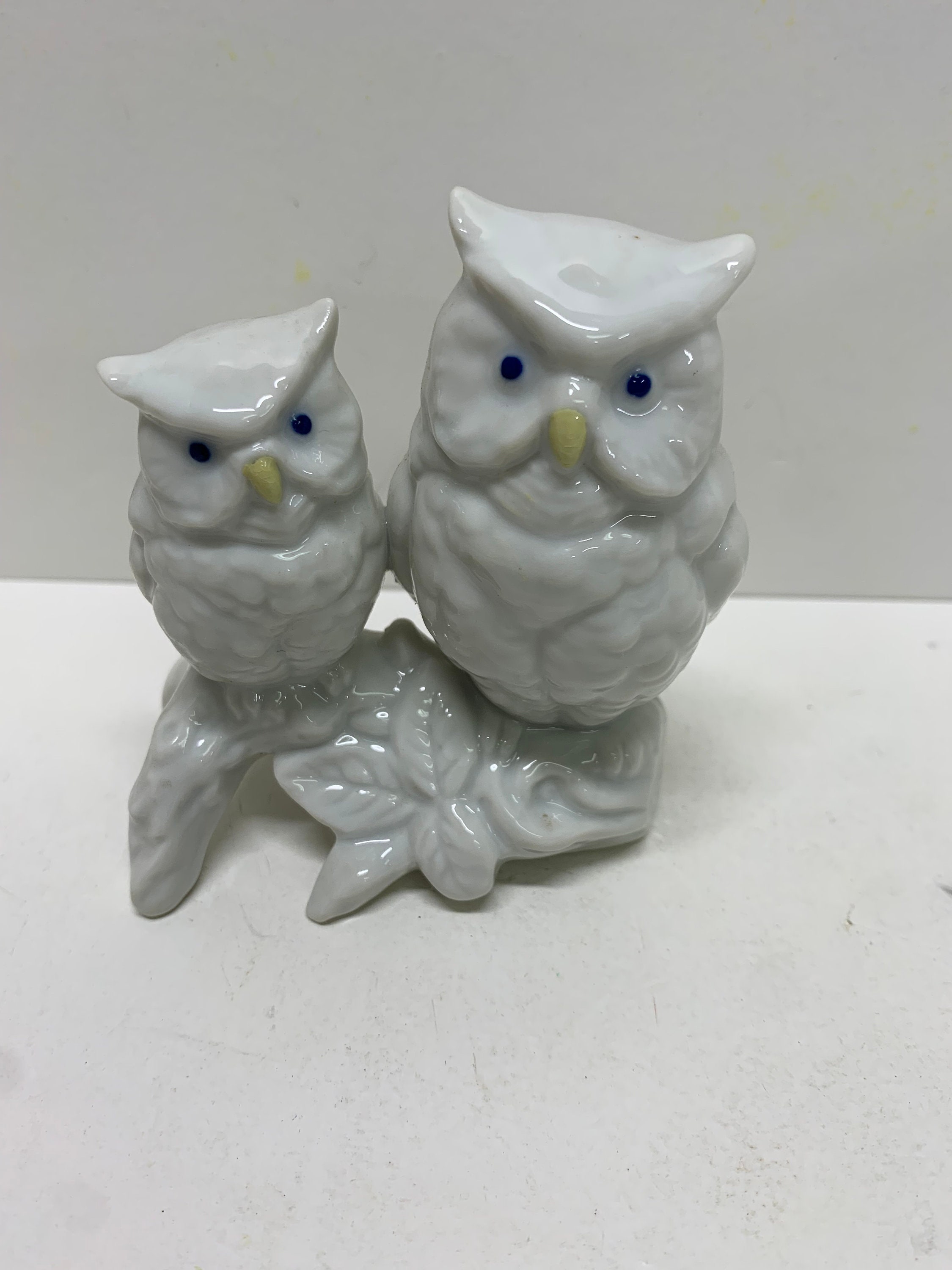 vintage dime store white ceramic owls sitting on a branch Japan.