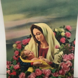 Vintage lenticular 3D postcard with religious lady with baby