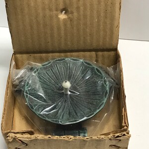 Vintage medium size faux patina metal candle base.