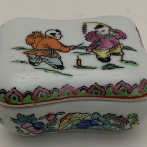 vintage dime store porcelain miniature  trinket box with children and firework&#39;s design