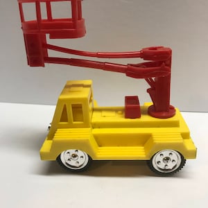 1960’s Cragstan plastic utility lift truck with friction drive.