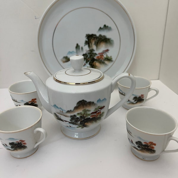 Vintage dime store Asian porcelain teapot set with4 cups and tray village mountain scene.