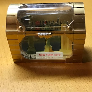 Vintage New York City treasure chest snow globe with world trade center, liberty, empire state bldg