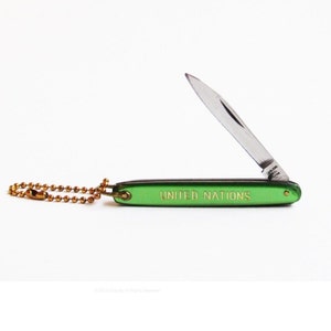 1970s United Nations pocket knife key chain. image 1