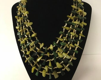 1960’s costume jewelry necklace two tone shell beads.