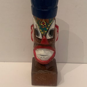 Vintage dime store  hand carved Mini totem/tiki statue .
