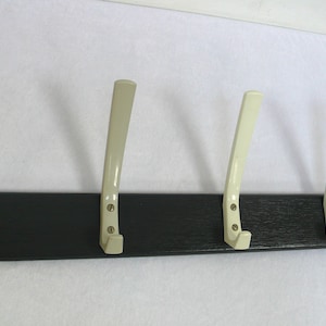 70s Coat Rack 4 white Vinyl Hooks on black wooden frame, Mid Century Germany