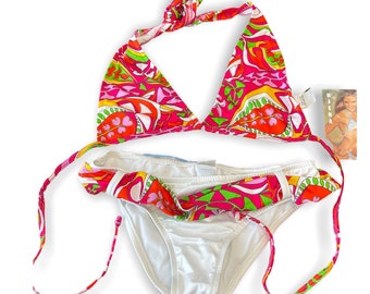 May include: A pink, green, and white patterned bikini top and bottom. The top is a triangle style with adjustable straps. The bottom is a simple, white bikini bottom with a patterned waistband.
