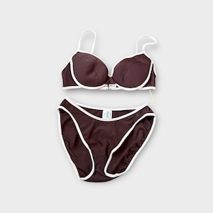 May include: A two-piece swimsuit set in a dark brown color with white trim. The top is a bra-style design with adjustable straps, and the bottom is a classic brief cut. The set is displayed on a light gray background.