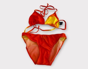 May include: A red and yellow bikini with a triangle top and a high-cut bottom.