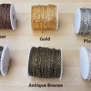 May include: Six spools of chain in different metal finishes: copper, gold, platinum, gunmetal, antique bronze, and silver. Each spool is wound with a chain link.