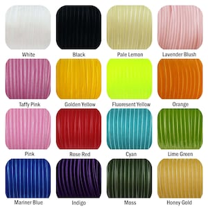 May include: A collection of 16 spools of velvet ribbon in various colors, including white, black, pale lemon, lavender blush, taffy pink, golden yellow, fluorescent yellow, orange, pink, rose red, cyan, lime green, mariner blue, indigo, moss, and honey gold.