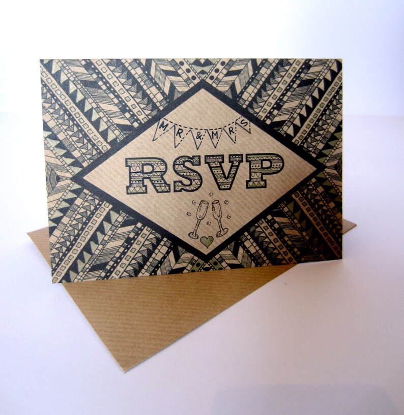 May include: A brown card with a black and white geometric pattern. The card has a diamond shape in the center with the text "RSVP" in black and white letters. The text "Mr. & Mrs." is above the RSVP in smaller letters. There are two champagne glasses and a heart below the RSVP.